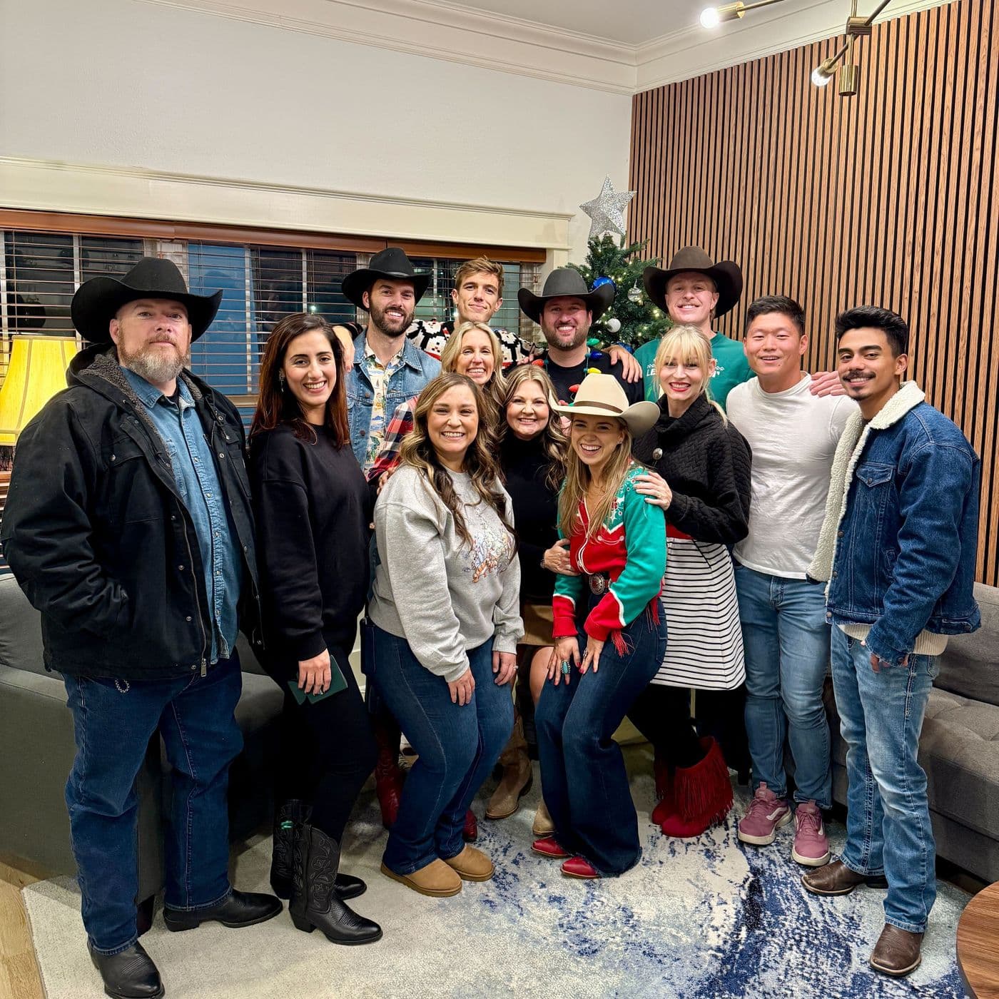 JRE team in western wear at a holiday party